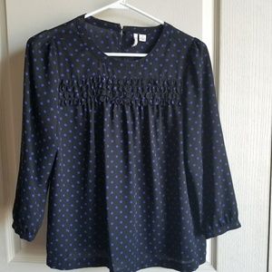 Black and blue polka dotted baby doll top